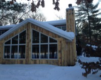 Exterior of a three seasons room, Legend Lake.
